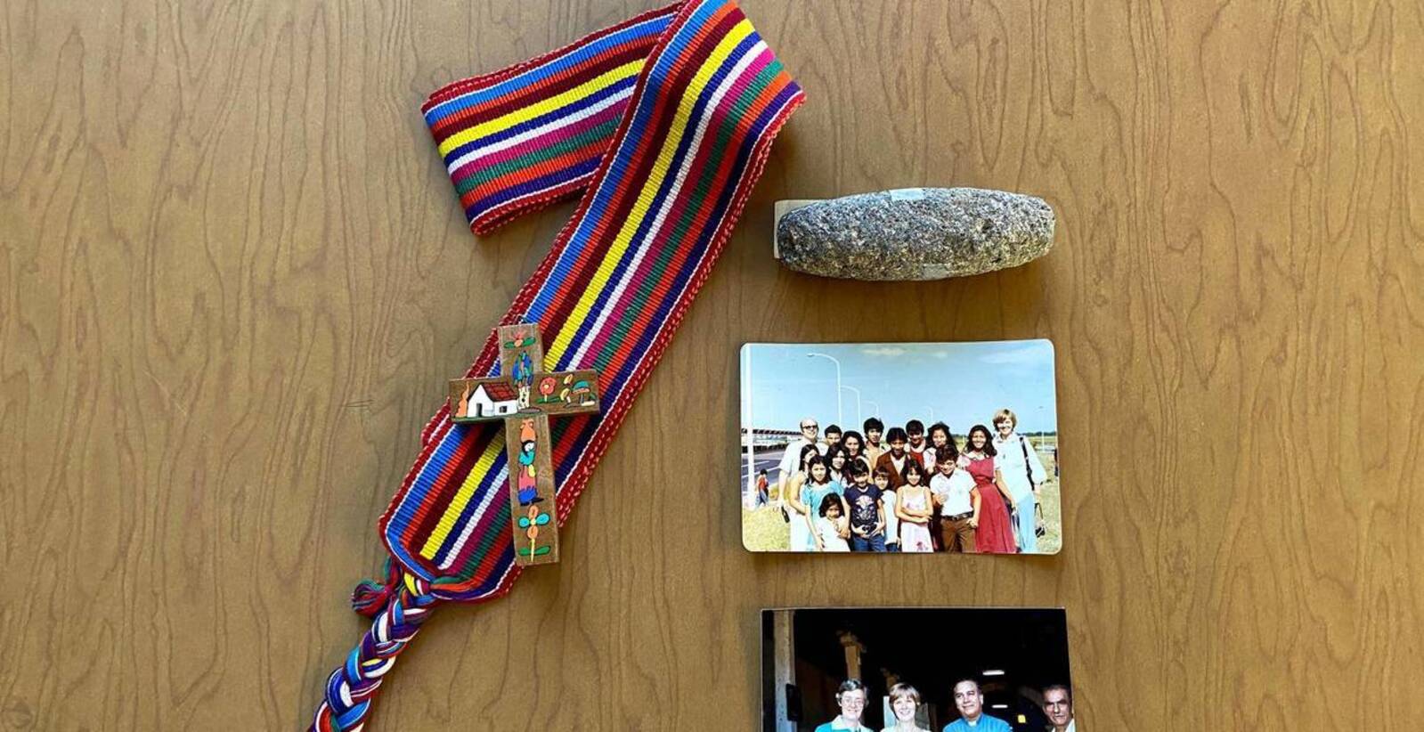 Multi-colorwrapbeltfromGuatemala,SmallLaPalma(art)cross,DorothyandFr.PaulSchindlerwithagroupofSalvadorans(Fall1980),LastphototakenofDorothybeforeherdeath(Nov.21,1980),Volcanicstoneusedtorolltortillas